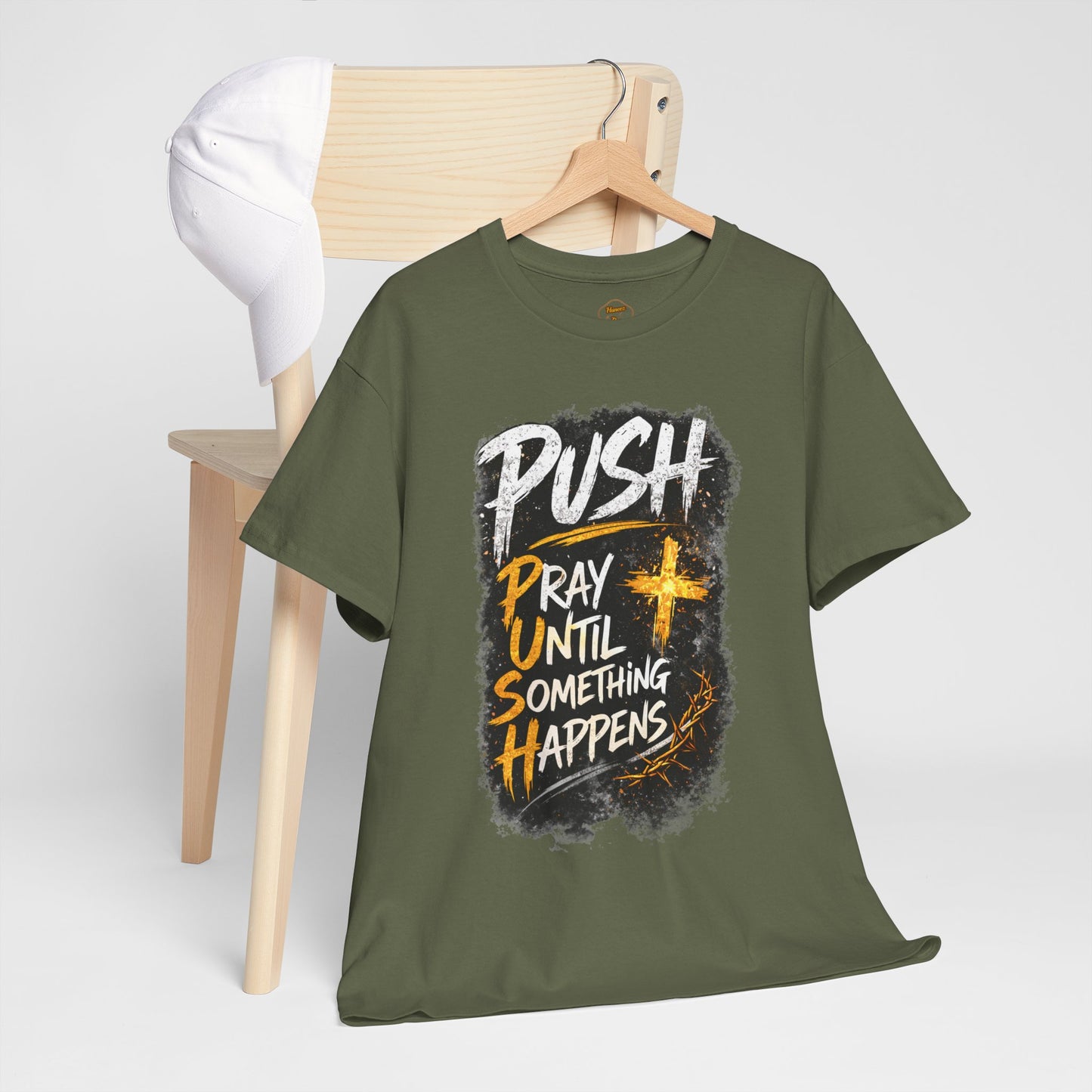 Green t-shirt with motivational quote on a wooden hanger against a white background